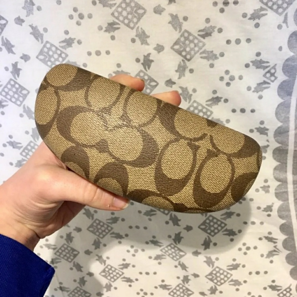 Brown and tan Coach eye glass case